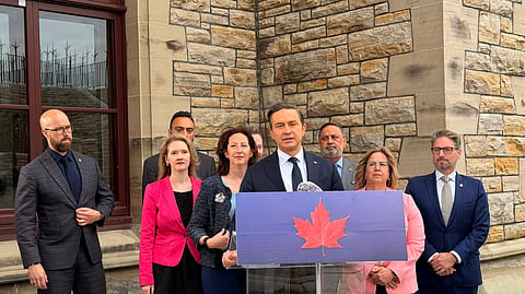 Pierre Poilievre (center)
