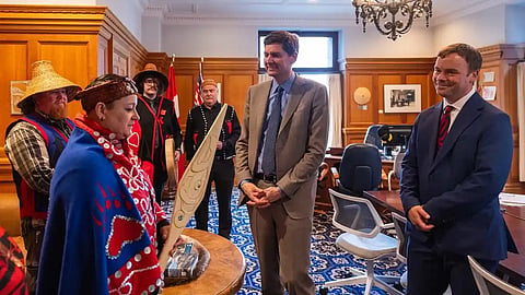 K’omoks Chief Counsellor Nicole Rempel presents Premier David Eby and Indigenous Relations Minister Spencer Chandra Herbert with a ceremonial paddle at a meeting in the premier’s office at the BC legislature, April 14, 2026. 