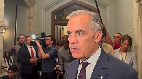 Mark Carney speaking to reporters