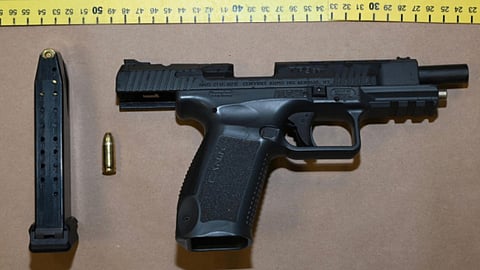 'Calgary man' charged after police seize handgun, hunt for two more suspects
