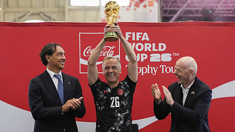 Mark Carney center raising the World Cup story
