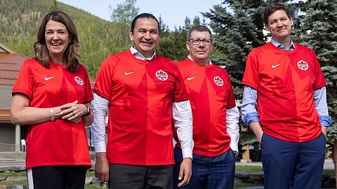 Alberta Premier Danielle Smith, Manitoba Premier Wab Kinew, Saskatchewan Premier Scott Moe, and BC Premier David Eby model their FIFA World Cup Team Canada jerseys at the Western Premiers’ Conference in Kananaskis, May 26, 2026.