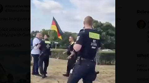 WATCH: Berlin police engage with tour guide displaying German flag near Reichstag