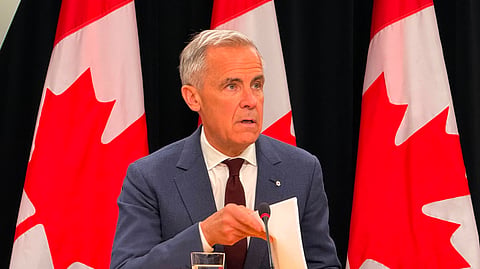 Mark Carney speaks to reporters at press gallery