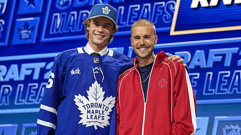 Gavin McKenna, the first overall pick by the Toronto Maple Leafs, poses with pop superstar and Leafs superfan Justin Bieber at the 2026 National Hockey League Entry Draft in Buffalo, N.Y., on June 26, 2026.