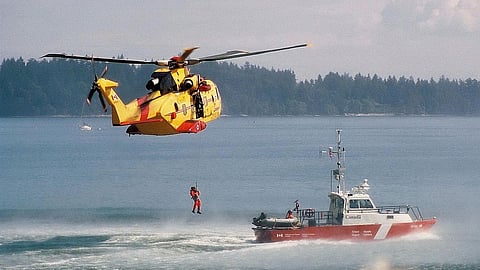A Canadian Armed Forces CH-149 Cormorant helicopter and Coast Guard vessel during a search and rescue operation in British Columbia waters. File photo illustrating the type of assets used in the Strait of Georgia charter boat incident near Sea Island.