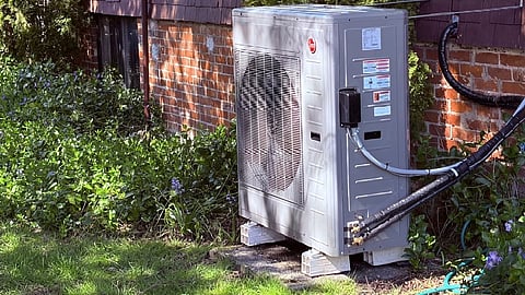 Heat pump installed at an older home, with electric power and hoses to circulate coolant to interior spaces. This works well in a mild climate to replace an oil furnace, but it’s now being subsidized to replace conventional electric heat as well.