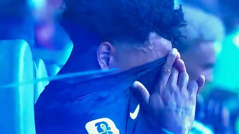 US player Weston McKennie sobs on the bench after embarrassing 4-1 demolition against Belgium