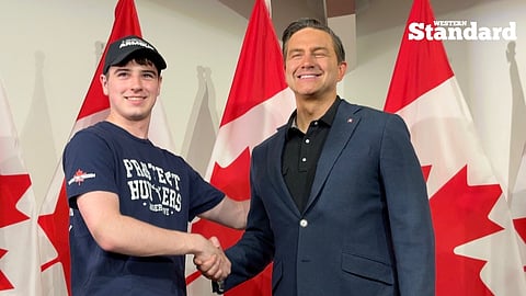 CPC Leader Pierre Poilievre shaking hands with a supporter at the party's BBQ in Edmonton. 