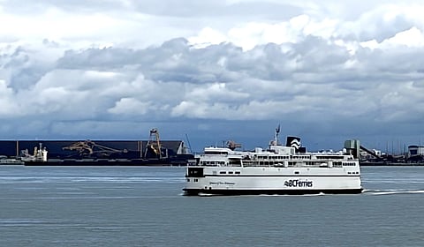 BC Ferries vessel leaves Tsawwassen terminal, passing Roberts Bank coal and container terminal. A planned expansion of the Roberts Bank terminal is now also the proposed site of an oil port to load Very Large Crude Carriers.