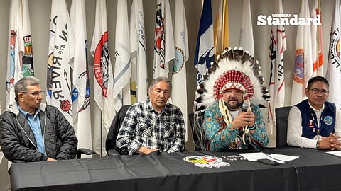 Chief Trevor Mercredi joined by other Treaty 8 First Nations chiefs speaking to reporters. 