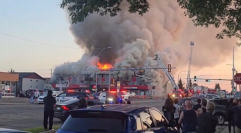 A screenshot of crews responsding to a fire in Edmonton after a vehicle colided with a semi-residential building on Monday. 