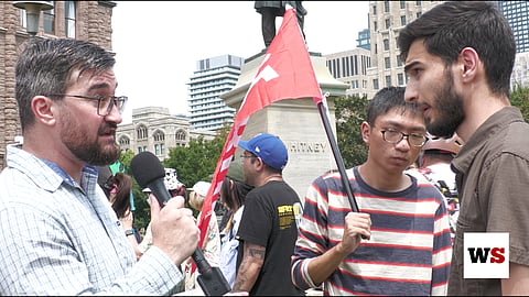 Protesters waved a communist flag as they expressed their dissatisfaction with the Doug Ford government