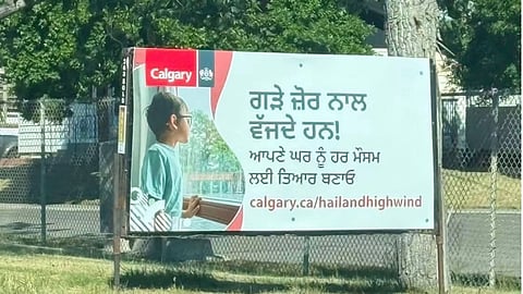 City of Calgary hail warning sign featuring Punjabi-language information
