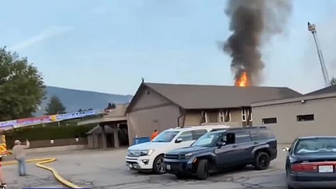 Flames burn through the roof of Vernon Alliance Church in Vernon on Monday. Still from circulating video.