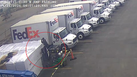 Zeng climbed a forklift in a FedEx parking lot 'to get a better angle to take pictures.'