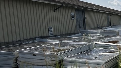 Stacks of expired solar panels in Brooks. 