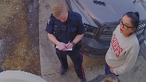 Crystal MacDonald pictured after the incident alongside police officers