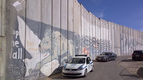 A high wall divides Israel from West Bank, underlining the distance between Israel and its Palestinian neighbours. A 'two-state solution' looks unlikely.