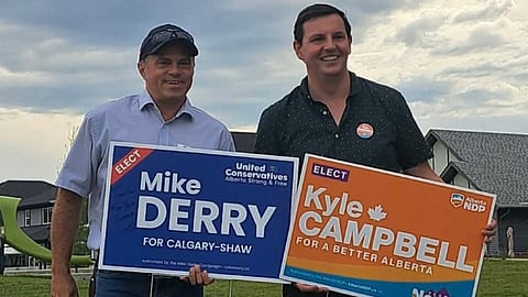 Calgary-Shaw UCP candidate Mike Derry and Alberta NDP candidate Kyle Campbell standing beside each other while campaigning ahead of the byelection. 