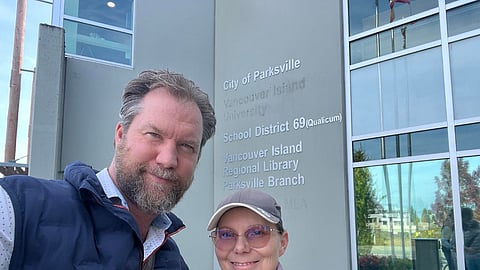 Mike Butler and council candidate Alana Barager outside the Vancouver Island Regional Library Parksville Branch.