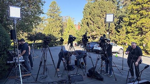 Television crews set up outside Government House in Victoria on Tuesday ahead of Premier David Eby's expected meeting with Lt.-Gov. Wendy Lisogar-Cocchia.