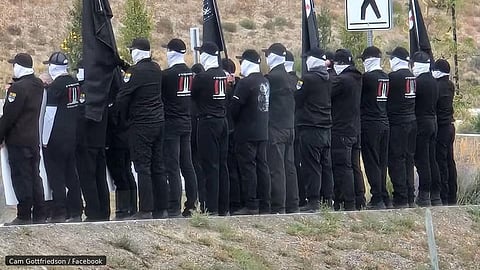 Masked men on the Tk’emlúps te Secwépemc reserve Sunday. 