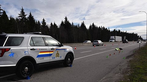 A crumpled yellow police vest marks the spot where a BC Highway Patrol officer was injured as Tobin Haas fled a traffic stop