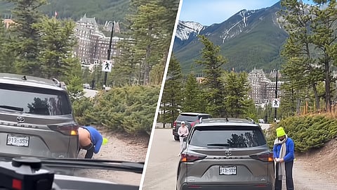 A video circulating on social media appears to show a woman relieving herself beside a busy roadway in Banff, Alberta