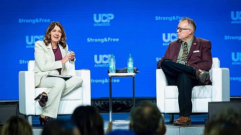 Premier Danielle Smith and UCP President Rob Smith on stage at the 2025 UCP AGM