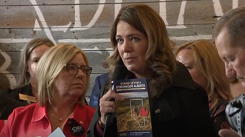 Premier Danielle Smith speaking at a federalist gathering and lobying Prime Minister Mark Carney about her nine referendum questions. 