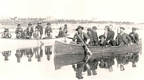 Reverend Thompson Ferrier of Brandon Indian Residential School transporting indigenous students from Berens River to Brandon in 1904.