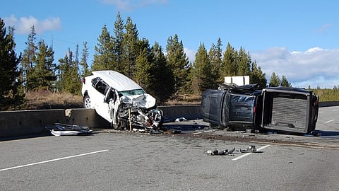 A black Toyota Tacoma and a white Toyota Rav 4 that were heavily damaged after a head-on collision on Highway #5