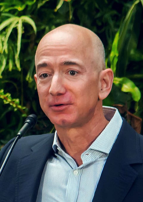 Bezos gives Dolly Parton $100 million, then lays off 10,000 Amazon staff