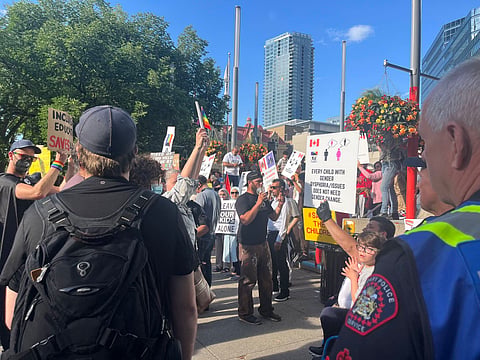 About 250 people rallied against children being taught sexual minority topics in schools in Calgary. 