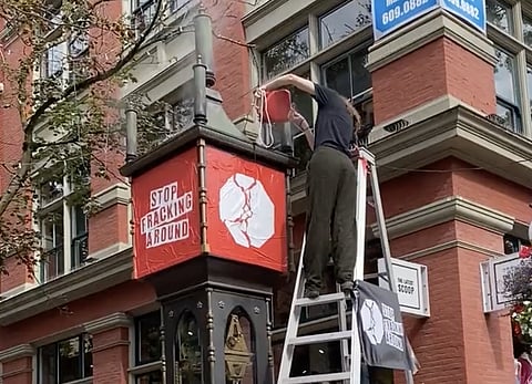 WATCH: Anti-fracking protesters dump molasses on Gastown Steam Clock