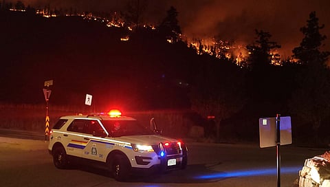 Police road block in BC challenged by large group trying to enter Evacuation Order area
