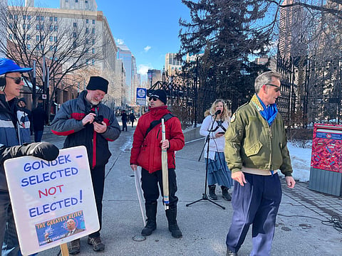 About 30 people gathered at Olympic Plaza to protest against biological males being allowed into female changerooms in City of Calgary facilities. 