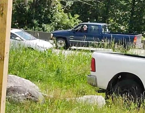 Driver accused of running over people during residential school march turns self in