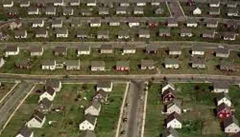 CMHC says Canadians must abandoned suburbs for high-density housing to ease climate change