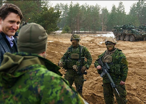 SLOBODIAN: Trudeau must have thought he was with his friends in Davos, not with Canadian troops in Latvia