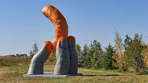 Cheetos unveils giant statue of hand with orange dust in Cheadle