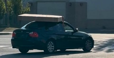 WATCH: Big screen bandits flee B.C. store with purloined 75" TV precariously balanced on car's roof