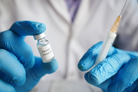 A needle and vaccine