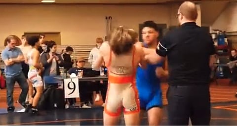 FULL NELSON KNUCKLE SANDWICH: Defeated wrestler sucker punches winner