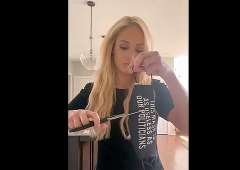 WATCH: Tomi Lahren cuts mask to protest mandates returning