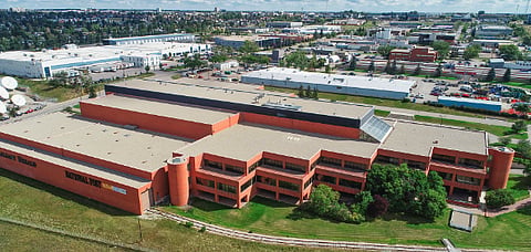 Postmedia closes a dozen Alberta print editions, sells Herald building